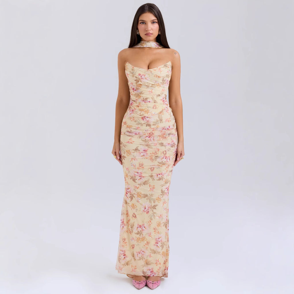 Model wearing a high-end floral tube top and maxi skirt set, featuring a sexy slim-fit 2-piece design for resort wear.