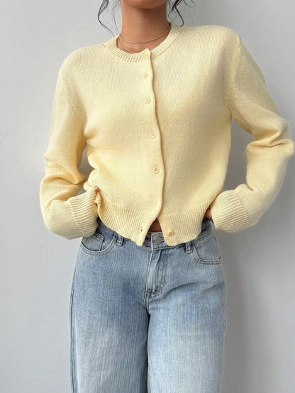 Women's slim fit short knitted cardigan sweater in solid [Color] with long sleeves.