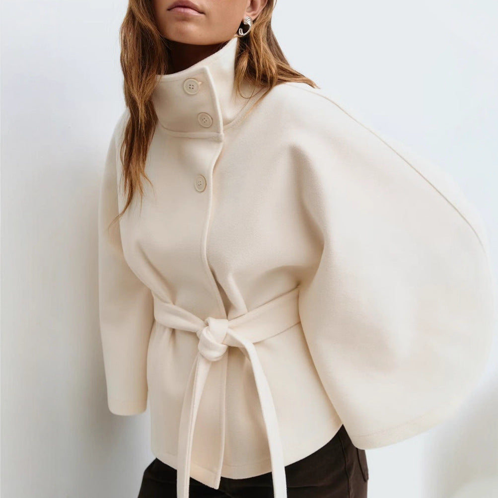 Close-up on the voluminous batwing sleeve and wide armhole of the winter coat.