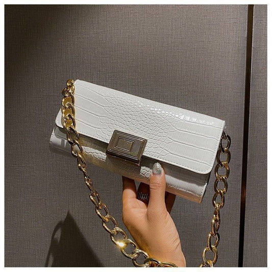 Eine Schulter- und Unterarmtasche Damen Baguette Bag
