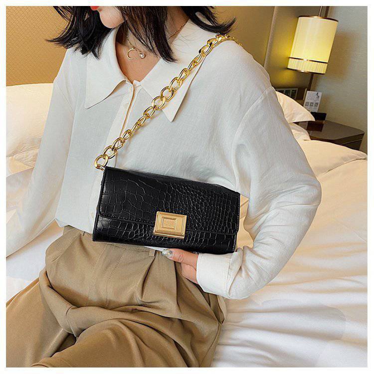 Eine Schulter- und Unterarmtasche Damen Baguette Bag