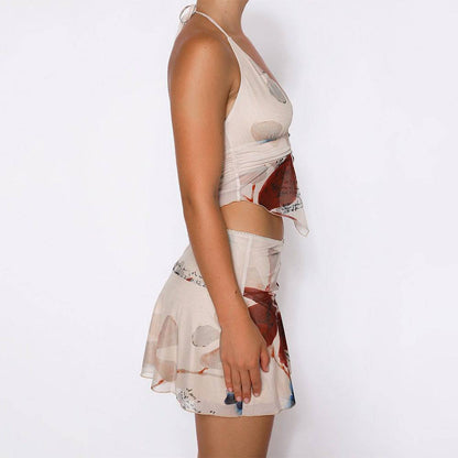 Kleid mit Neckholder-Top mit V-Ausschnitt und kurzem Plisseerock